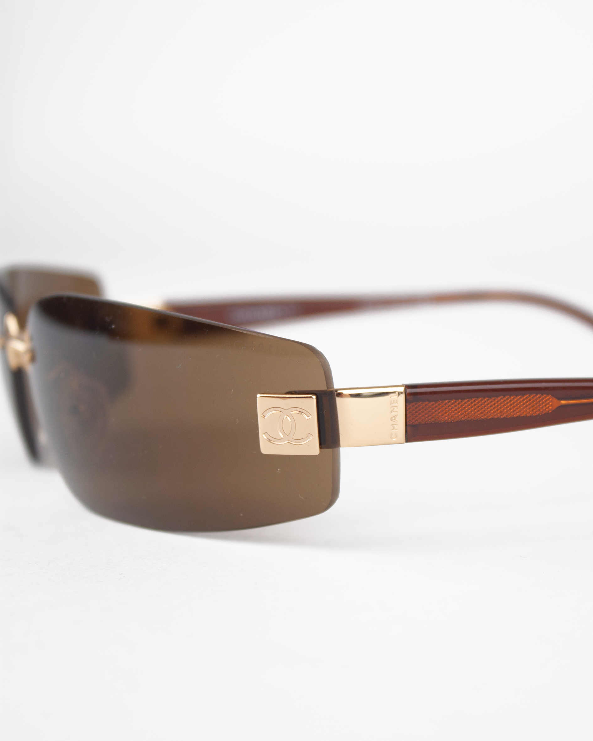 Gold and Brown Rimless Sunglasses