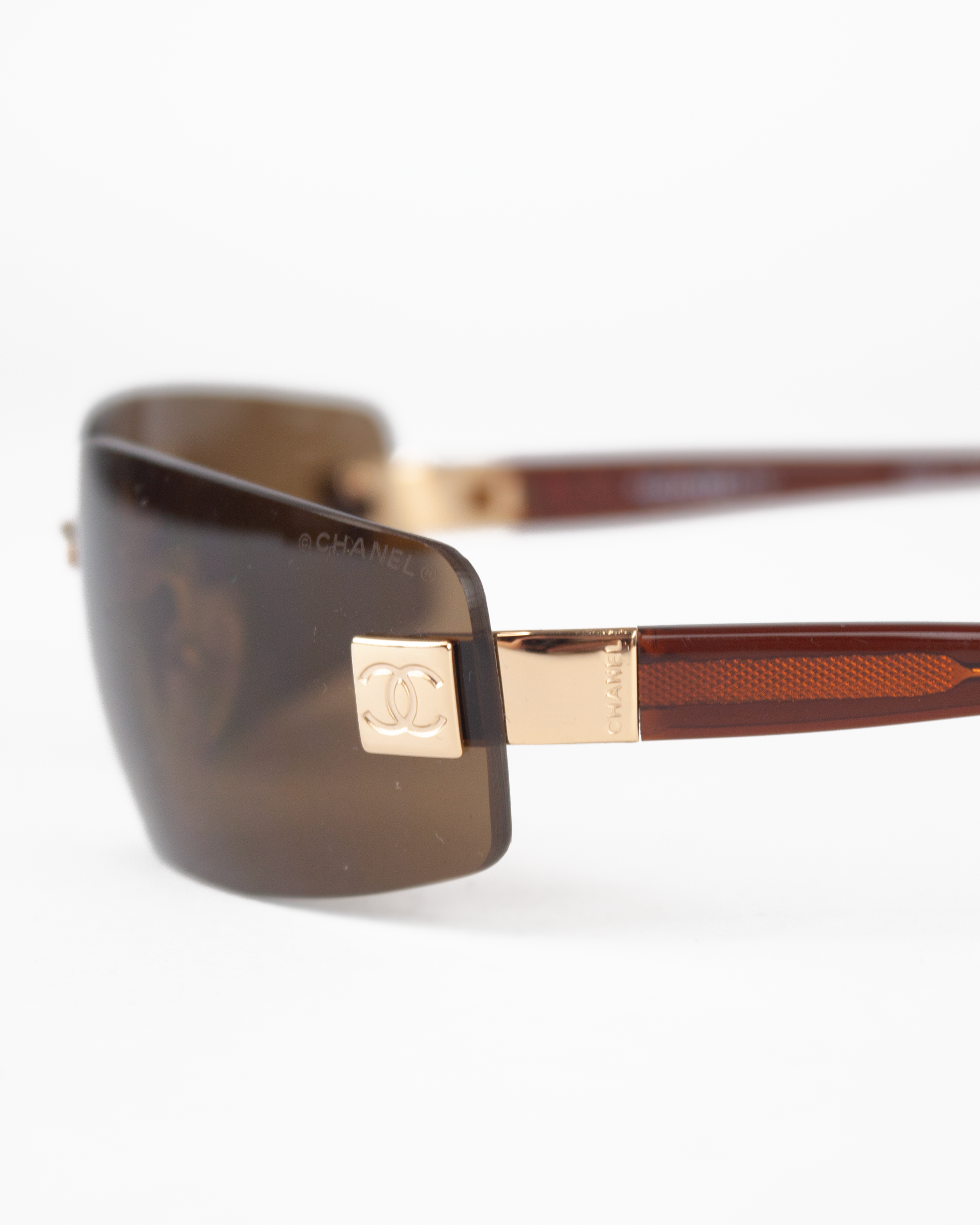 Gold and Brown Rimless Sunglasses