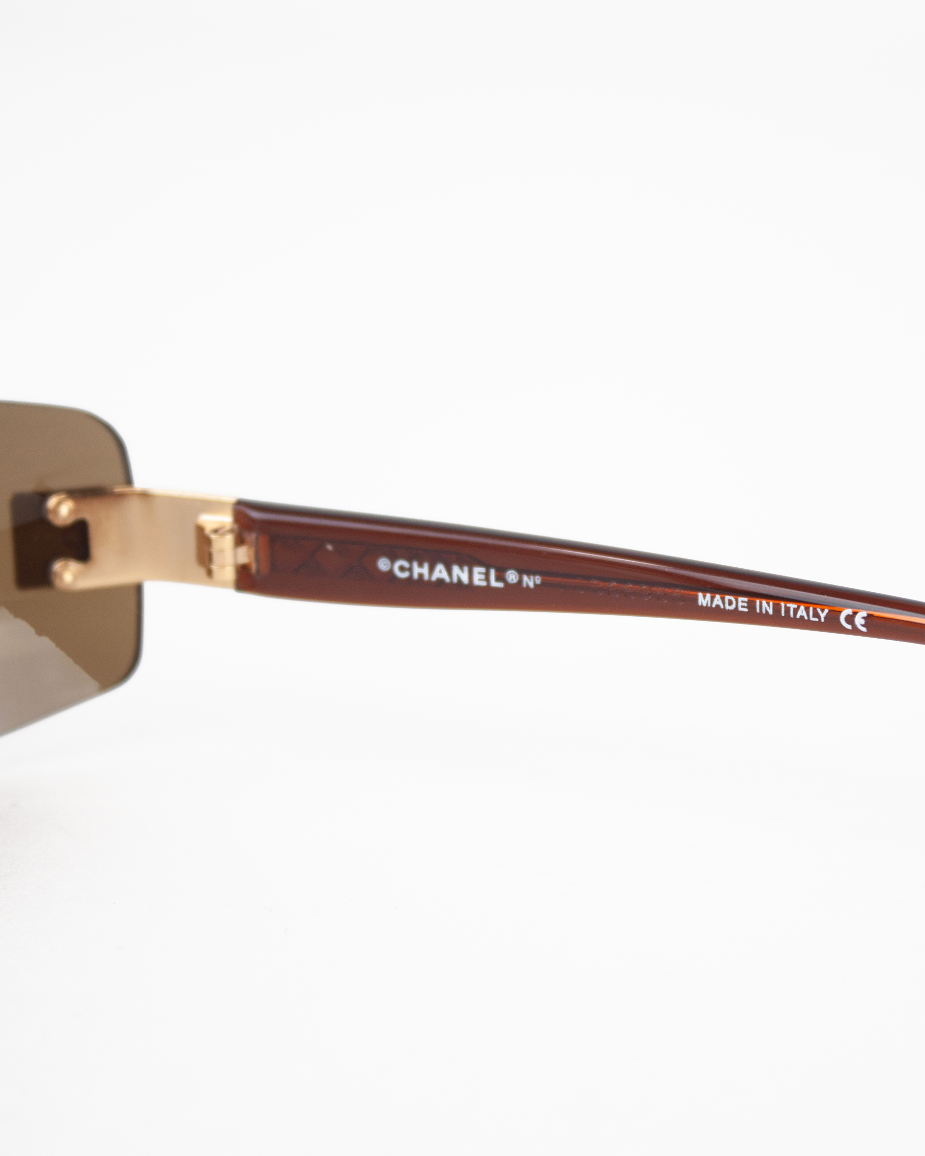 Gold and Brown Rimless Sunglasses